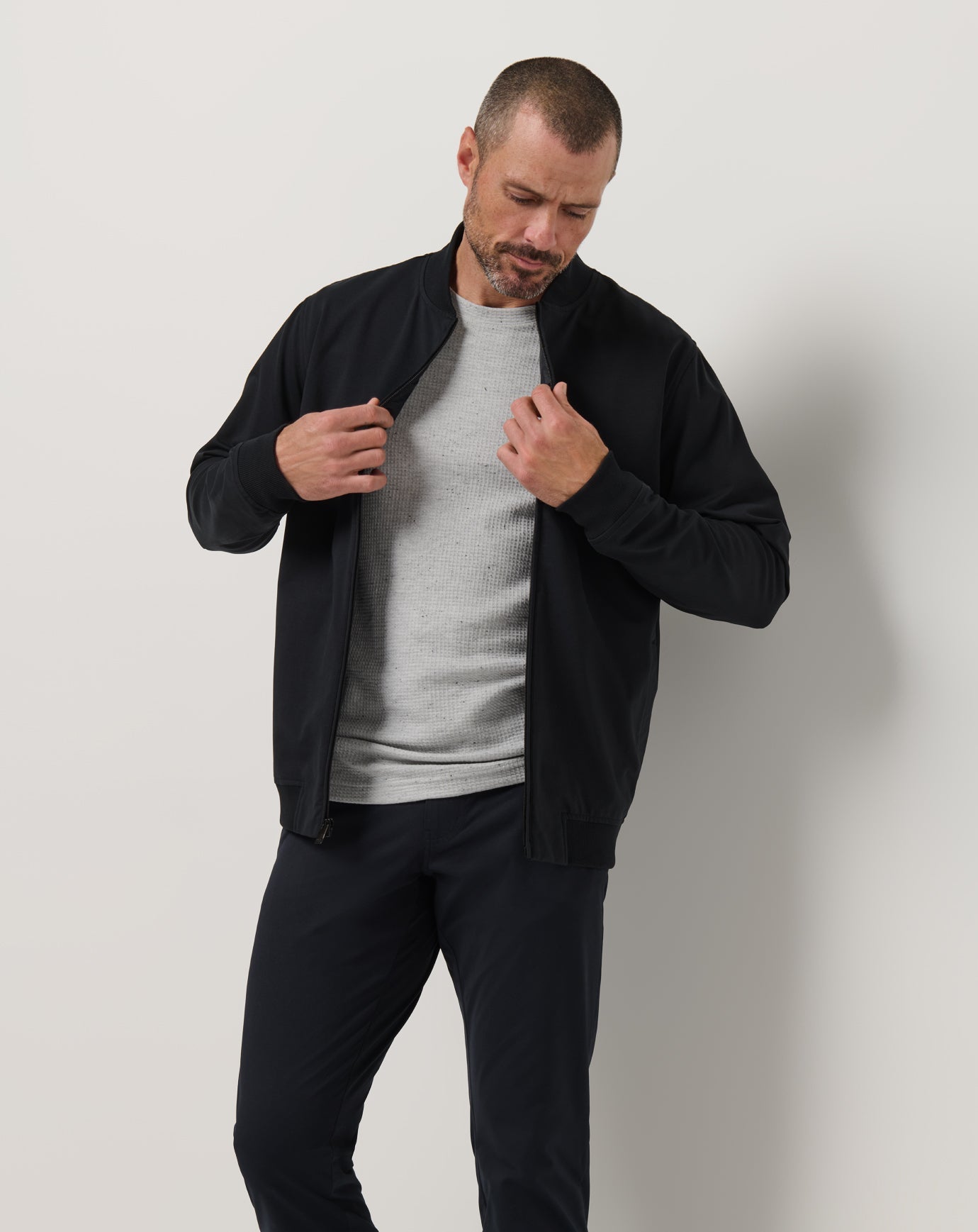 TravisMathew Stretchknit Bomber Jacket - Black